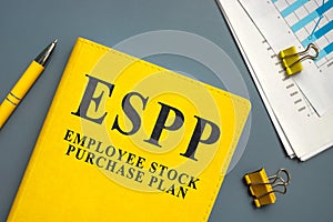 Employee Stock Purchase Plan ESPP papers with charts and pen.