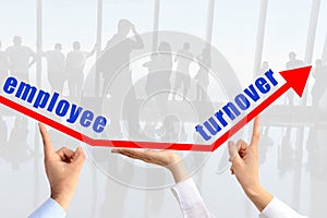 Employee turnover concept, with human hands sustaining an arrow photo