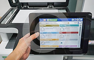 Employee use office printer machine for scanning business documents