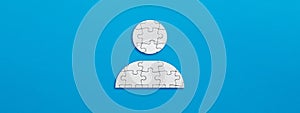 Employee or user icon made out of puzzle pieces. Team building, teamwork or collaboration