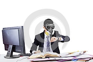 Employee wearing gas mask in workplace