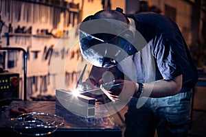 Employee welding aluminum using TIG