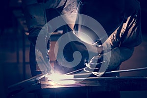 Employee welding aluminum using TIG
