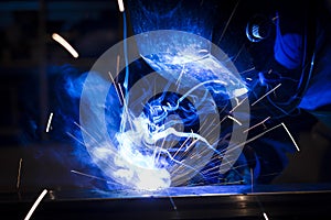 Employee welding using MIG/MAG. photo