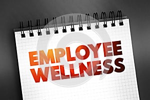 Employee Wellness - activities and programs aim to improve employee health and well-being, text on notepad, concept background
