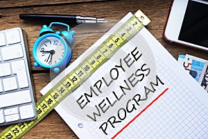 Employee wellness program written on personal agenda at the office