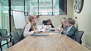 Employees of a colleague are gathered in meeting room, swear among themselves.