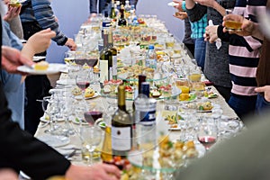 Employees of the company at the Banquet. Table with delicacies, alcohol and snacks. A gala reception