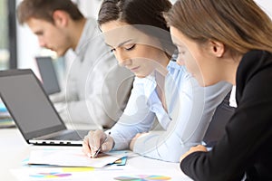 Employees coworking analyzing data