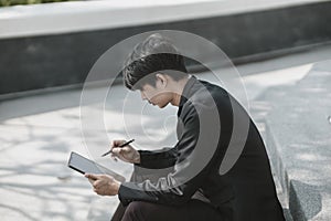 Employees fired or resigned from the company are using tablet to find a jobs..Unemployed, hiring job, quitting job concept