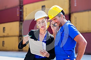 Employees in logistics company shipping containers