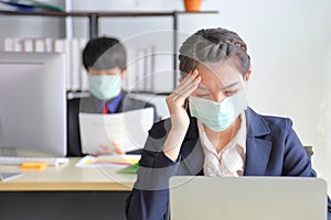 Employees working in business office got headache and fever while wearing medical face mask