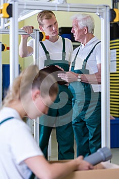 Employees working on production hall