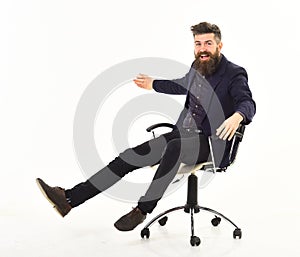 Employer with cheerful face sits on office chair