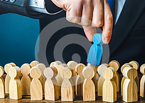 Employer chooses a blue person from the crowd of job candidates. Selects the best candidate for the job. Recruit new workers.