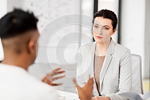 Employer having interview with employee at office