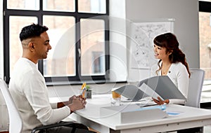 Employer having interview with employee at office