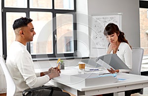 Employer having interview with employee at office