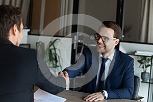 Employer hiring happy candidate after successful interview