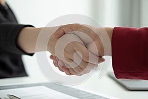 Employer shake hand with job applicants congratulates and welcomes new hires after successful negotiations for a job interview.