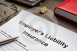 Employers liability insurance application form on the table.