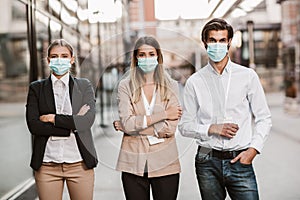 Employers standing outdoor wearing face mask