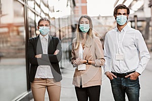 Employers standing outdoor wearing face mask