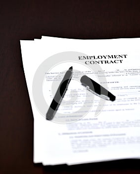 Employment Contract Document Agreement on Desk with Pen