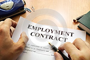 Employment contract on an office table. photo