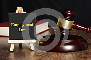 Employment Law sign with gavel and red book