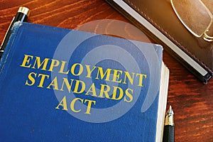 Employment standards act and glasses. photo