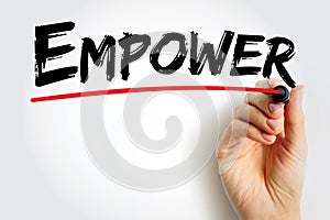 Empower - to give power or authority to, authorize, especially by legal or official means, text concept background