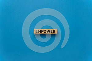 EMPOWER word written on wood block, business concept