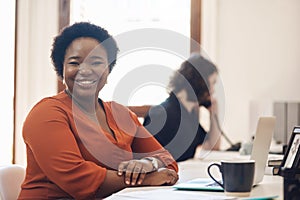 Empower yourself with confidence and tenacity. Portrait of a confident young businesswoman working in an office with her