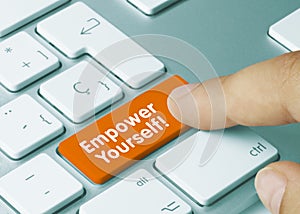 Empower Yourself! - Inscription on Orange Keyboard Key photo