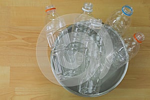 Emptied recyclable clear plastic mineral soda water bottles in a