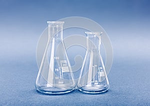 Empty 50 and 100 milliliter Erlenmeyer chemistry flasks