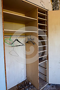 Empty abandoned wooden bedroom wardrobe on a deserted house