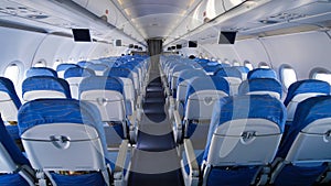 Empty aircraft cabin during flight. Blue salon.