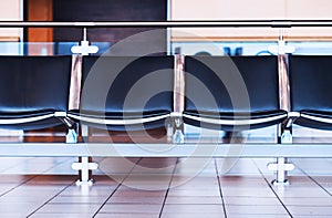 Empty airport seats bench bokeh background