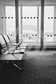 Empty airport terminal waiting area with chairs in Athens airport