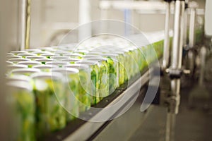 Empty aluminum cans for drinks move on conveyor