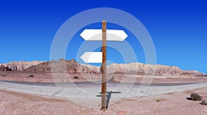 Empty arrow shaped signs in the middle of the desert