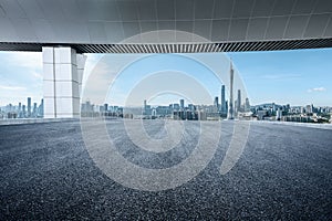 Empty asphalt and city buildings landscape