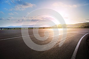 Art empty asphalt highway road bend and sunset sky