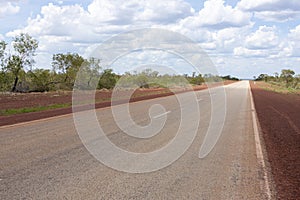 Empty asphalt road through Australian outback. Central Australia