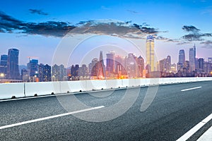 Empty asphalt road and Chongqing night cityscape