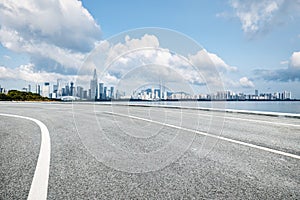 Empty asphalt road and city buildings skyline in Shenzhen