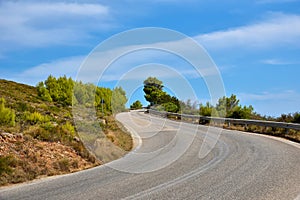 Empty asphalt road on the green mountain