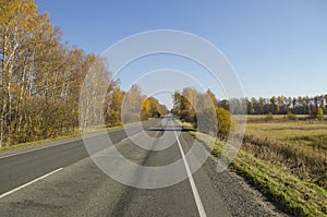 Empty asphalt road with markings.